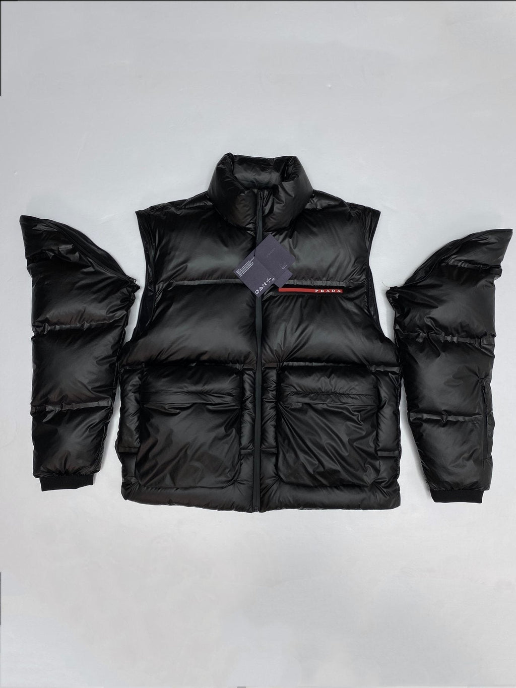 Prada Black Convertible Puffer Jacket with Red Chest Stripe — context