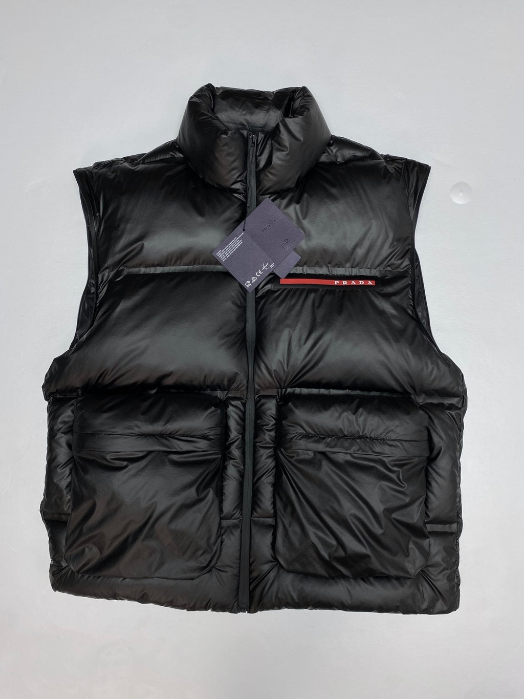 Prada Black Convertible Puffer Jacket with Red Chest Stripe — detail