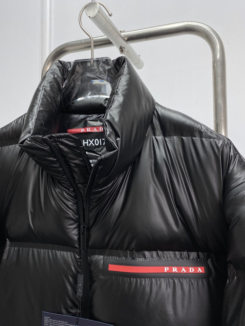 Prada Black Convertible Puffer Jacket with Red Chest Stripe — detail