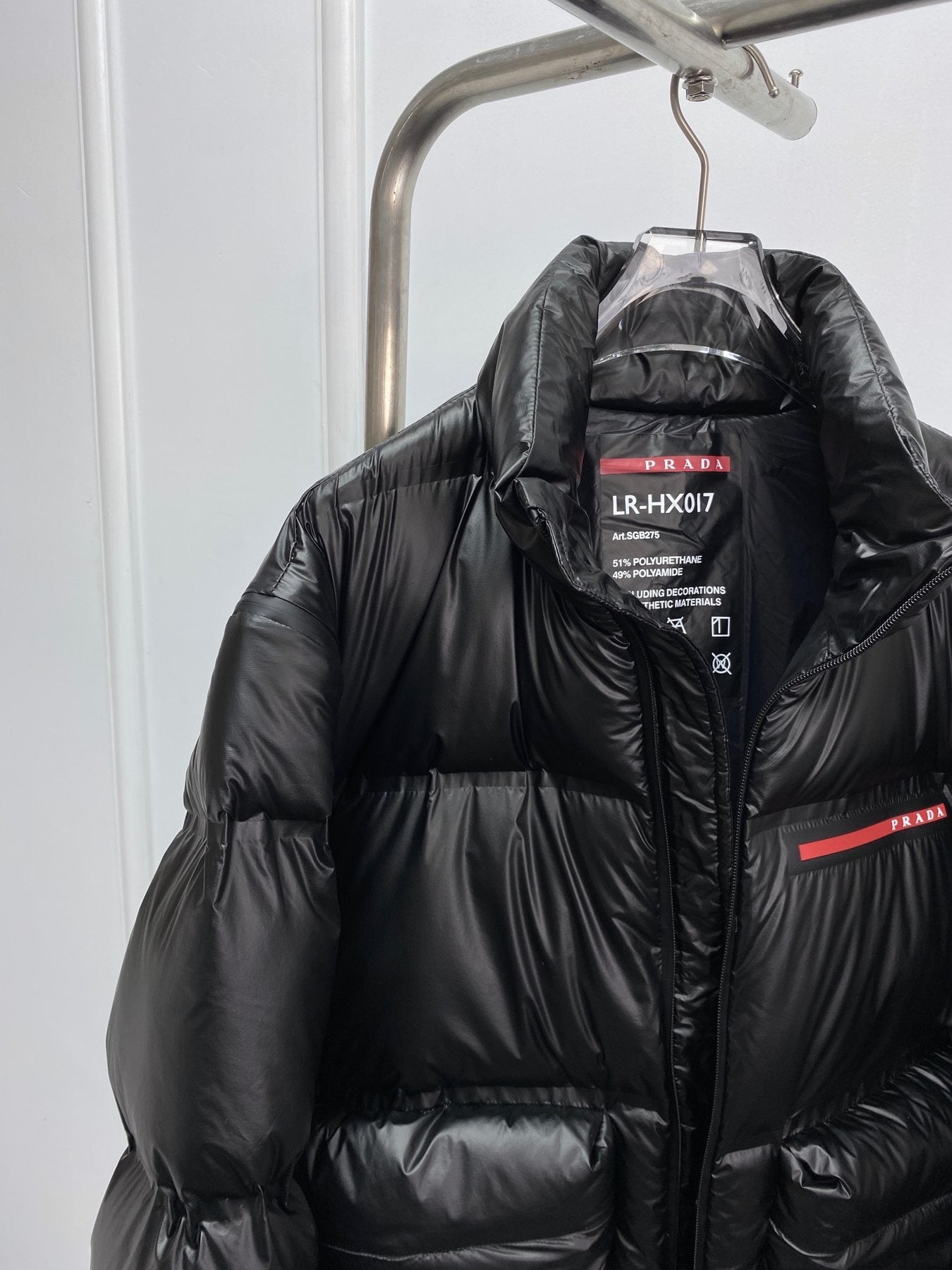 Prada Black Convertible Puffer Jacket with Red Chest Stripe — detail