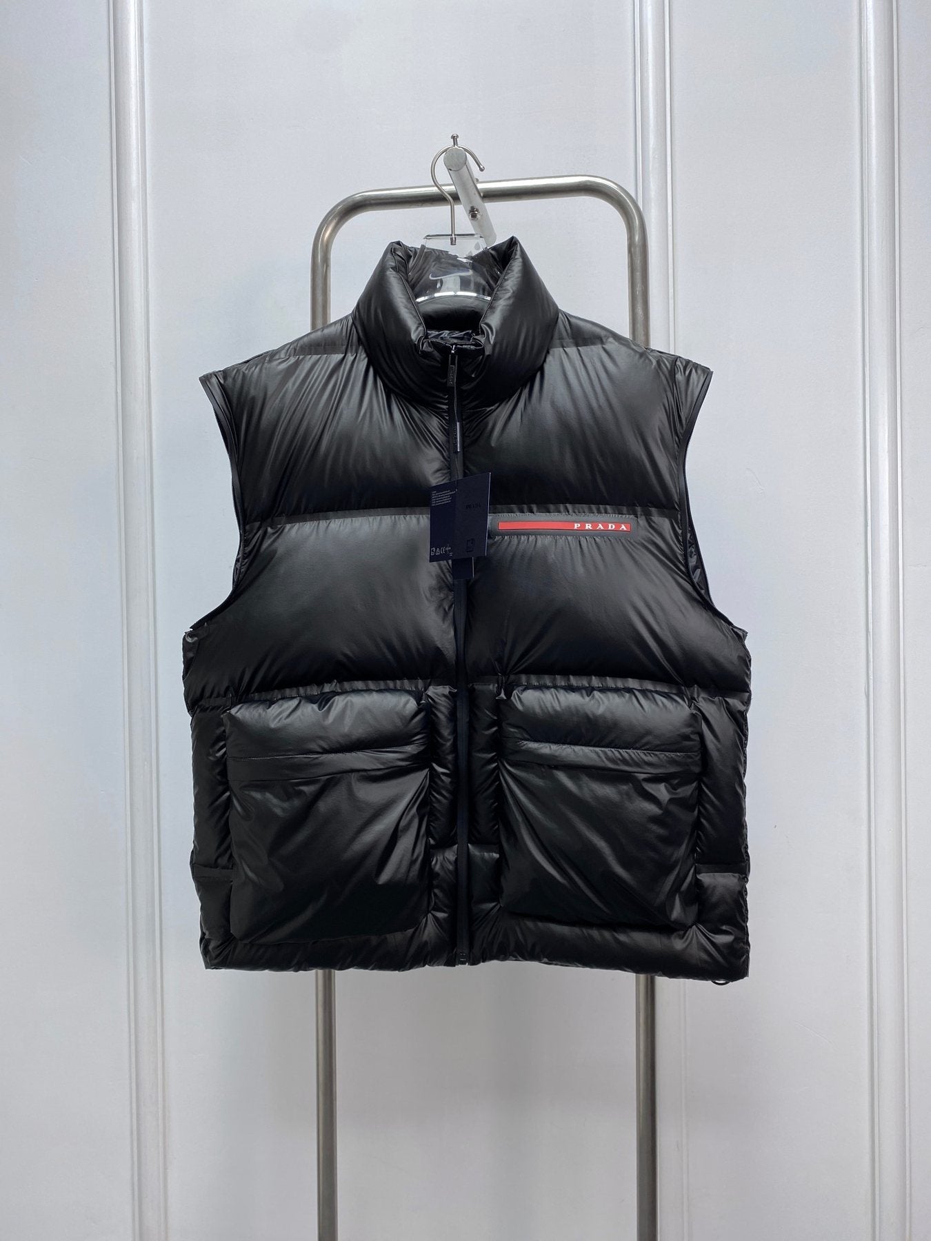 Prada Black Convertible Puffer Jacket with Red Chest Stripe — detail
