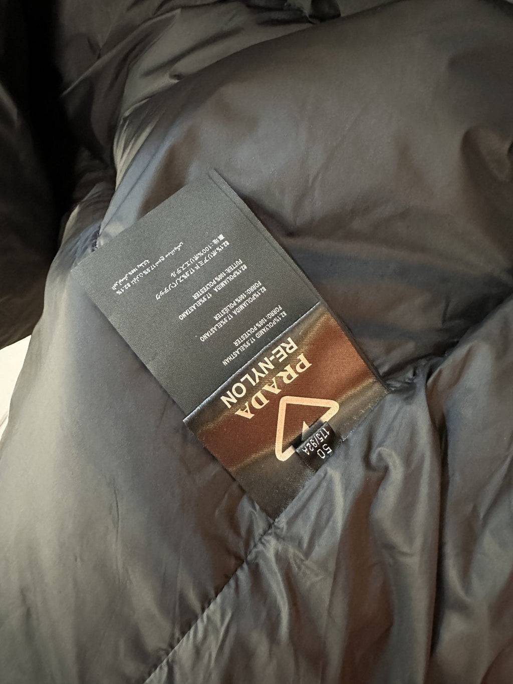 Prada Black Tonal Panel Puffer Jacket — hang_tag