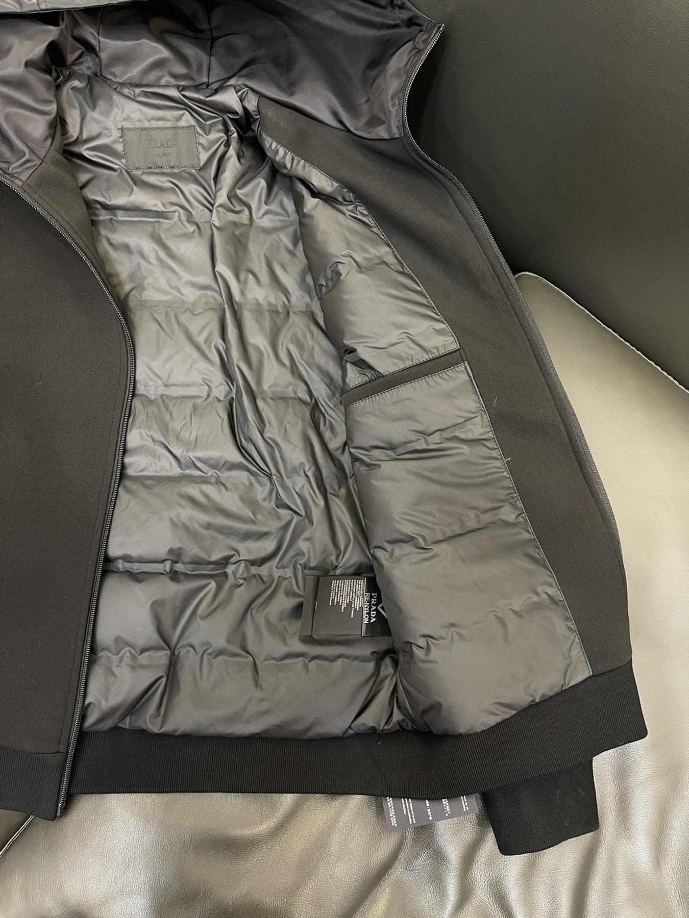 Prada Black Hooded Full-Zip Jacket with Triangle Chest Badge — detail