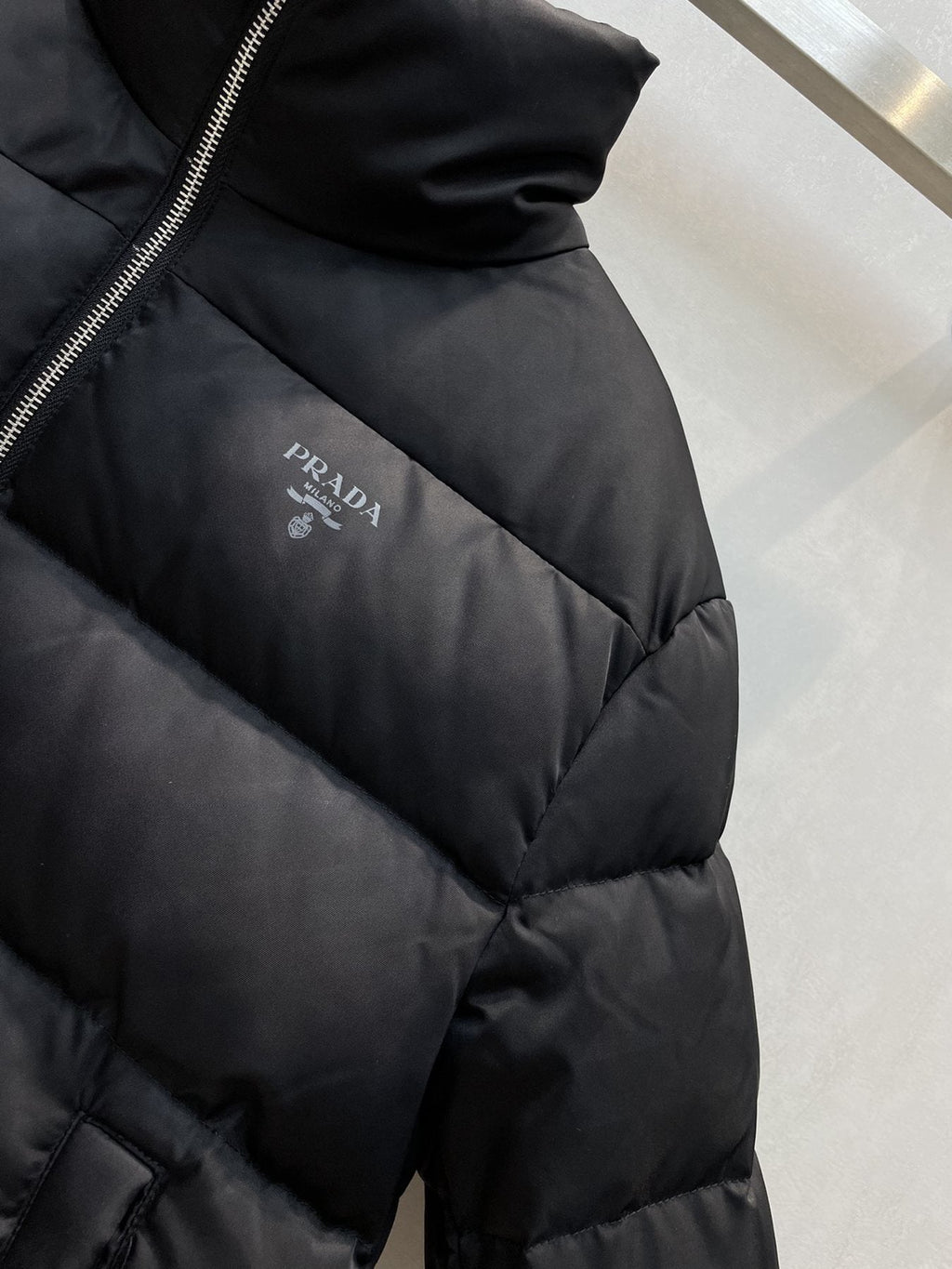 Prada Black Quilted Logo Puffer Jacket — detail