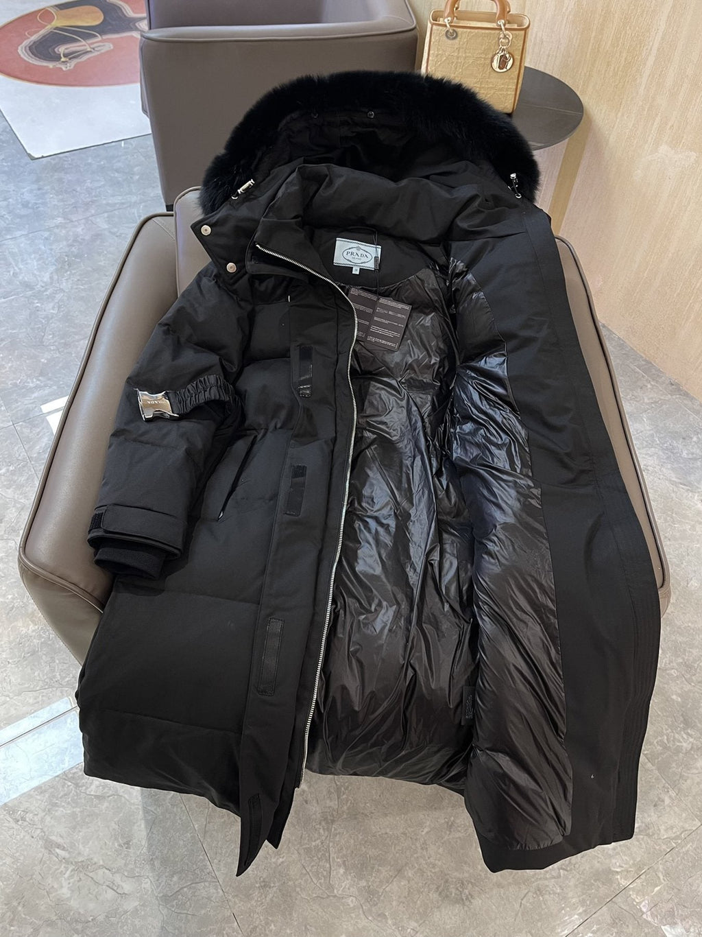 Prada Fur-Trim Belted Long Down Jacket — hang_tag