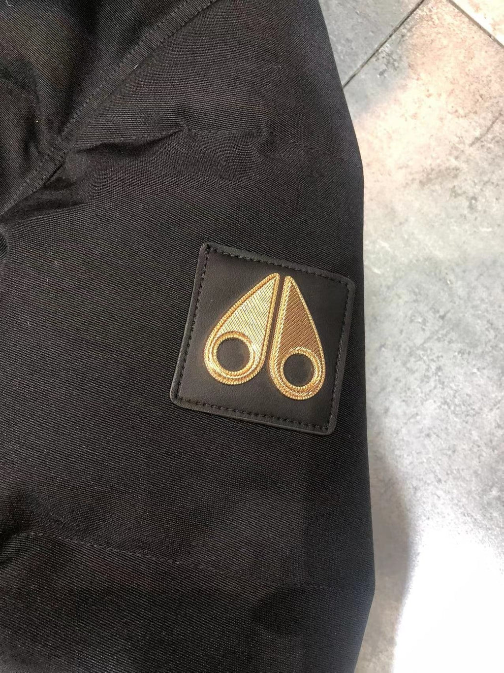 Moose Knuckles Black Hooded Puffer Jacket with Gold Lining — detail