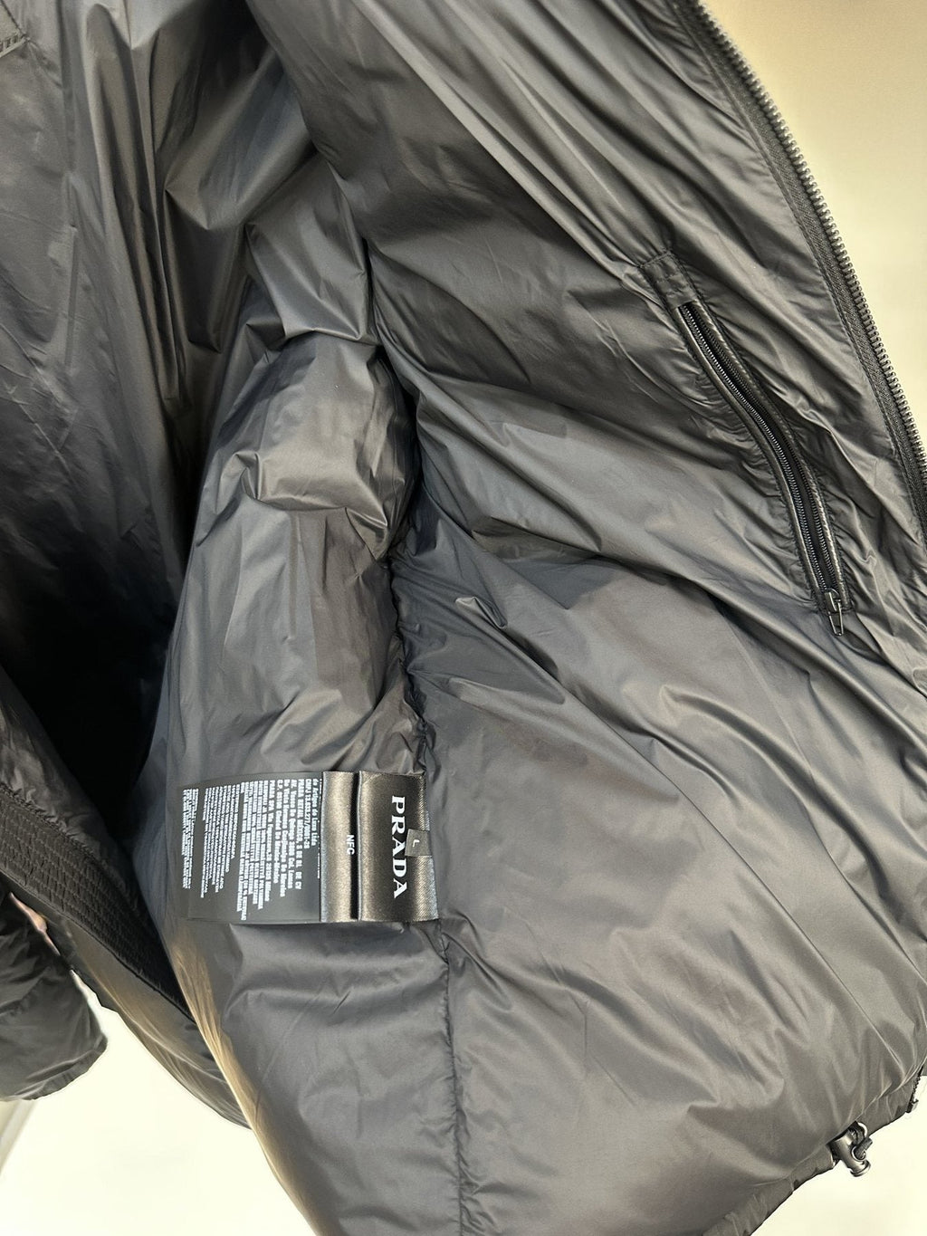 Prada Quilted Stand Collar Puffer Jacket — neck_label