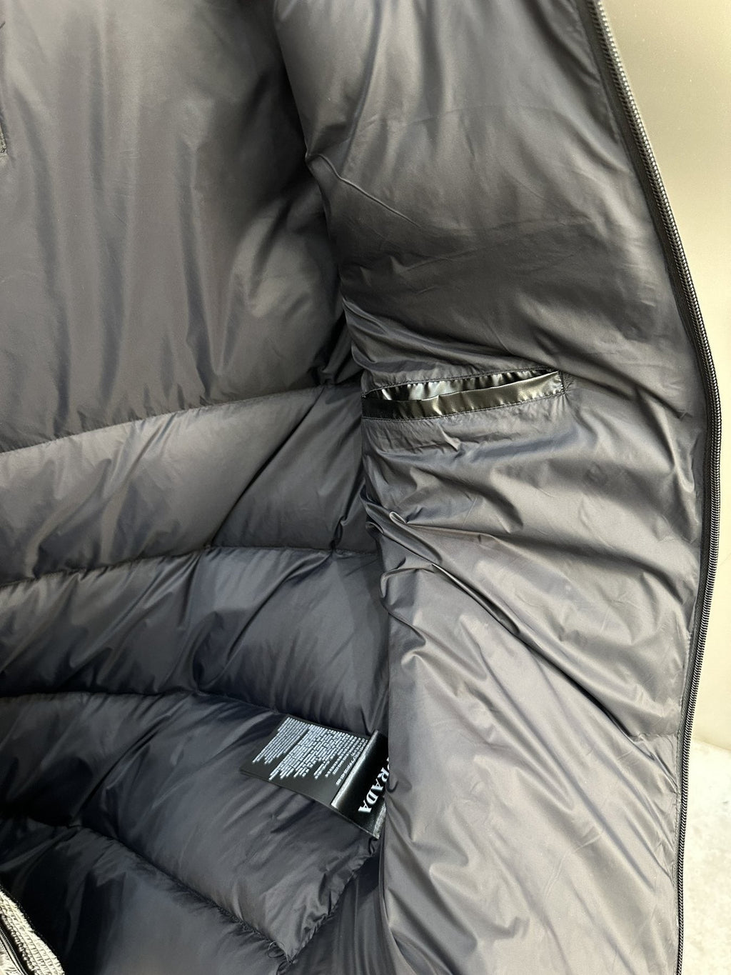 Prada Black Hooded Puffer Jacket — fabric_closeup
