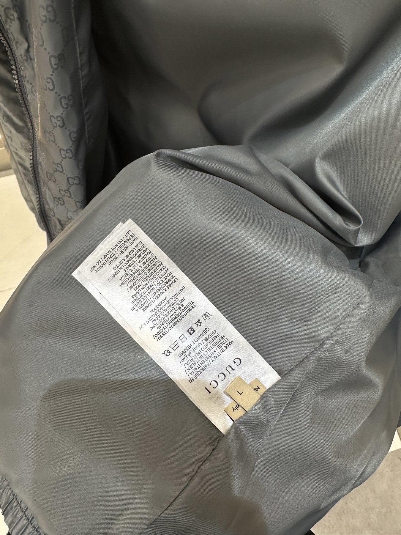 Gucci Monogram Hooded Zip Jacket — hang_tag