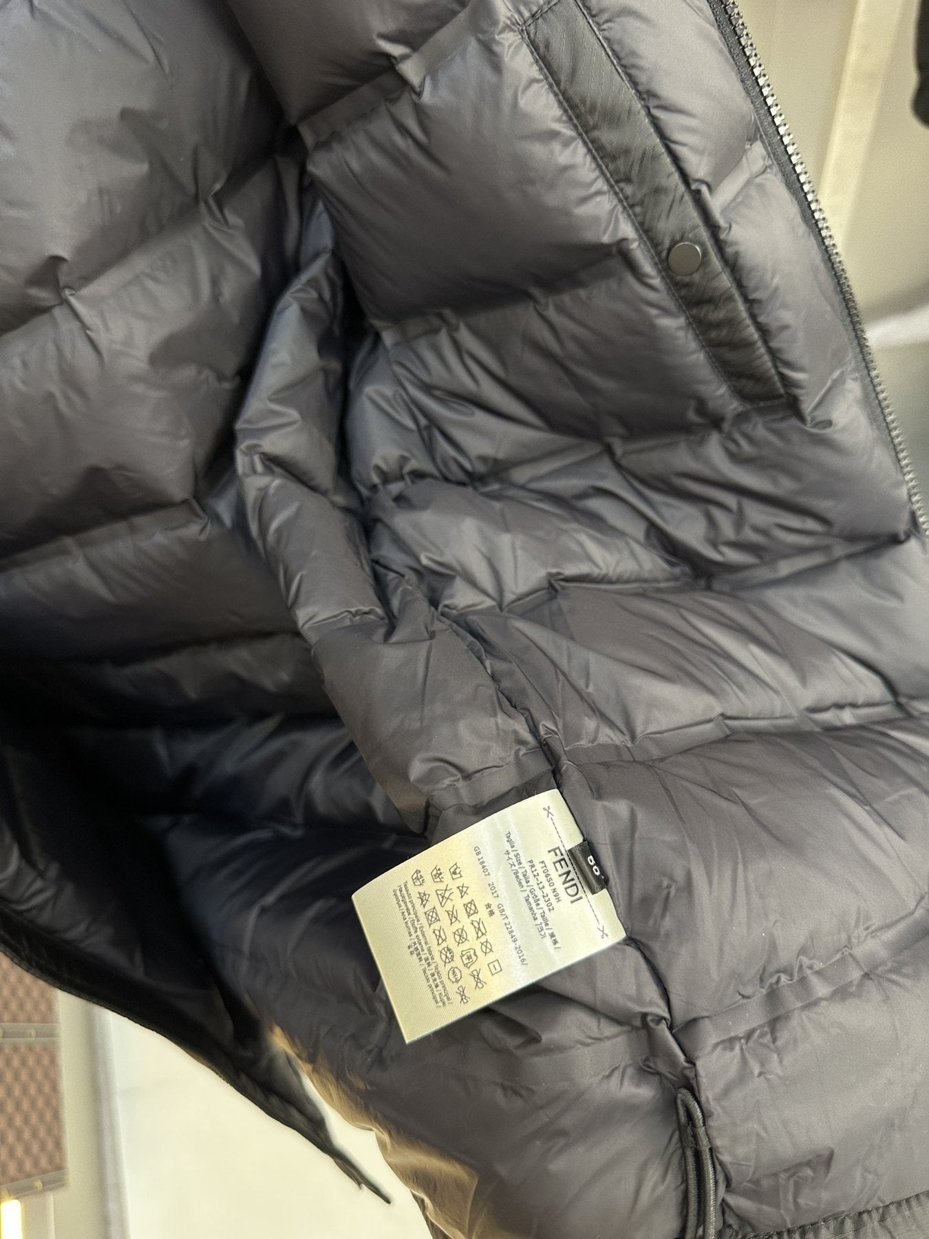 Fendi Black Hooded Puffer Jacket — hang_tag
