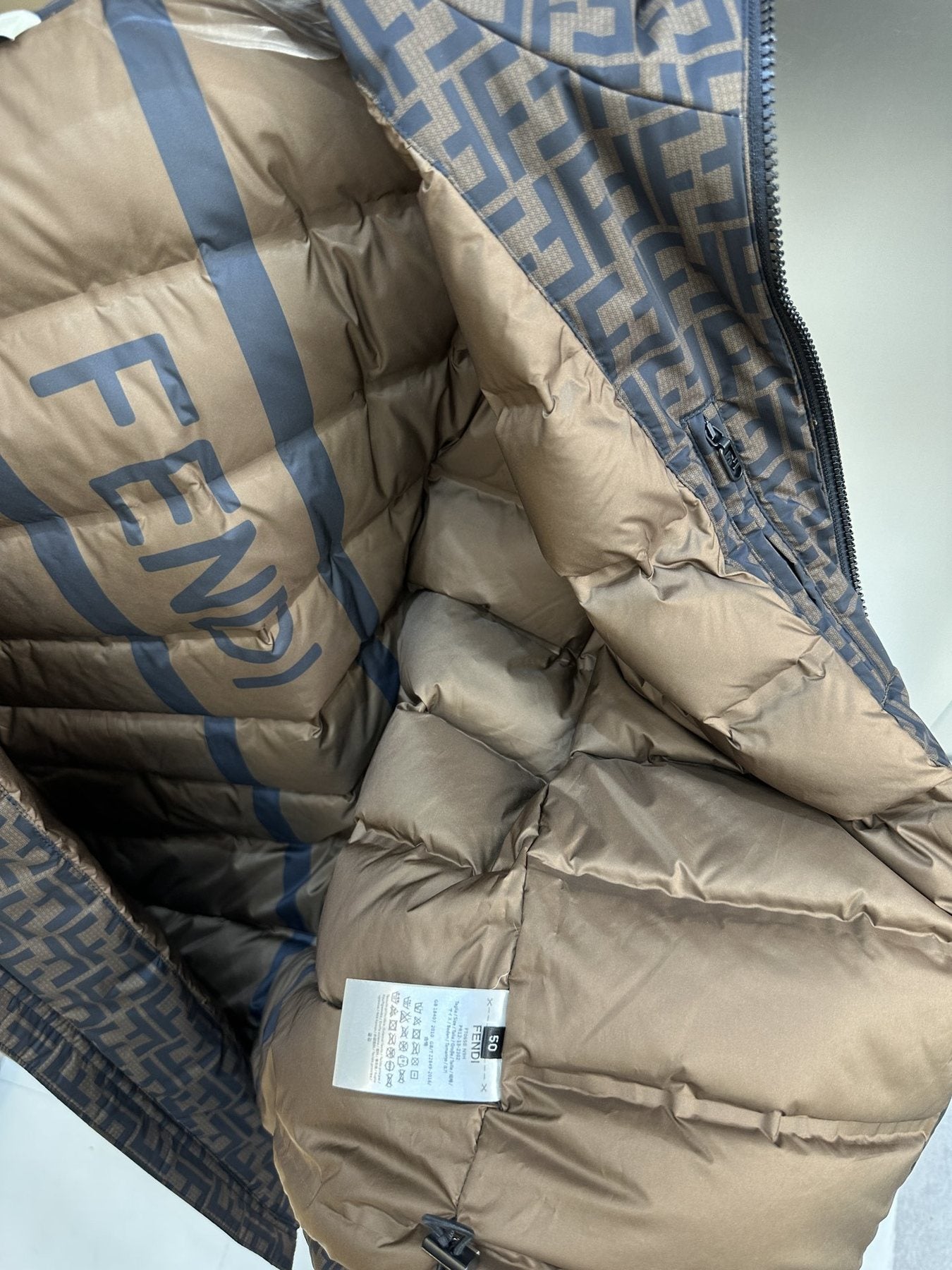 Fendi Brown Monogram Hooded Puffer Jacket — fabric_closeup