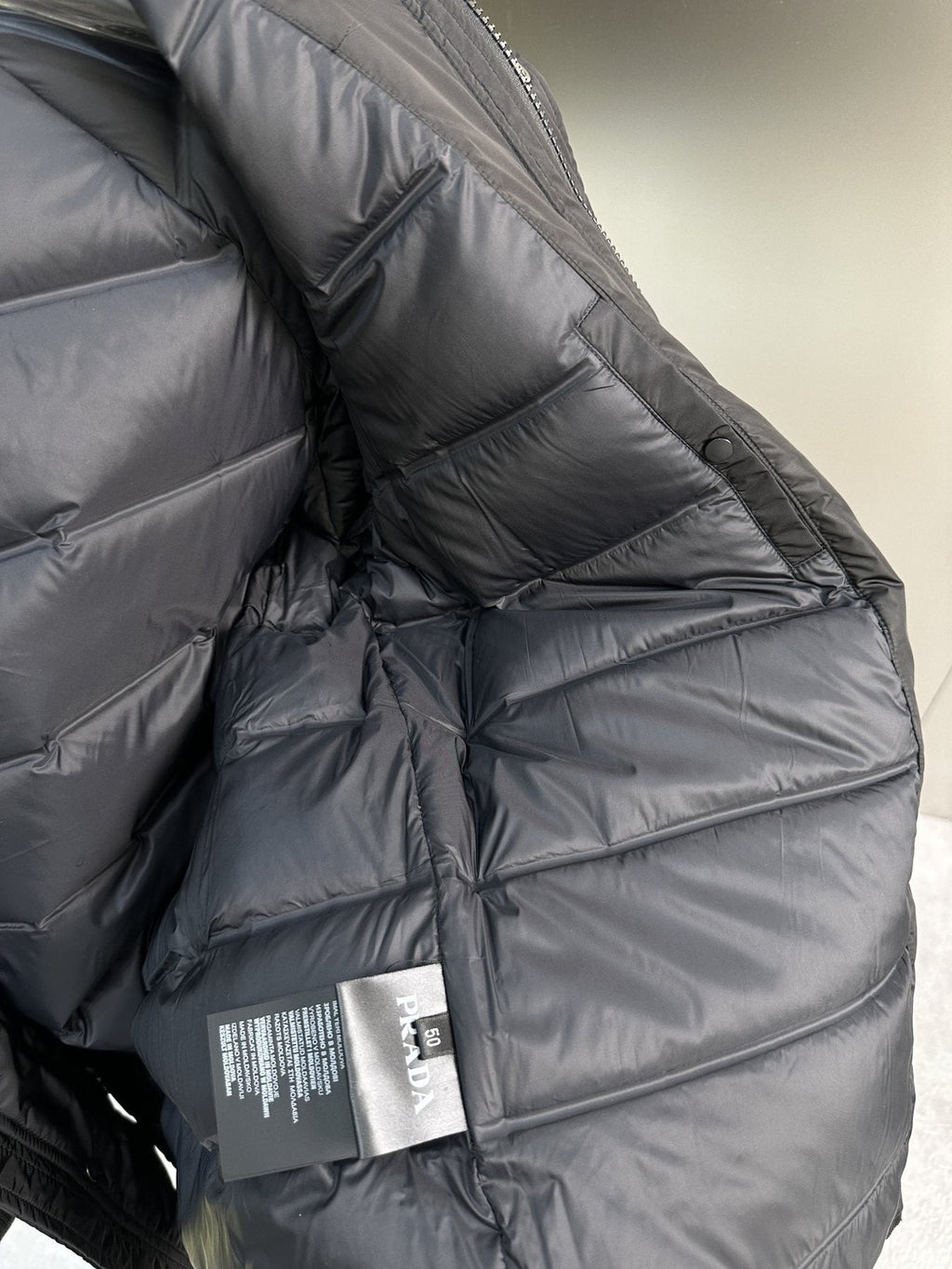 Prada Black Hooded Quilted Puffer Jacket — hang_tag