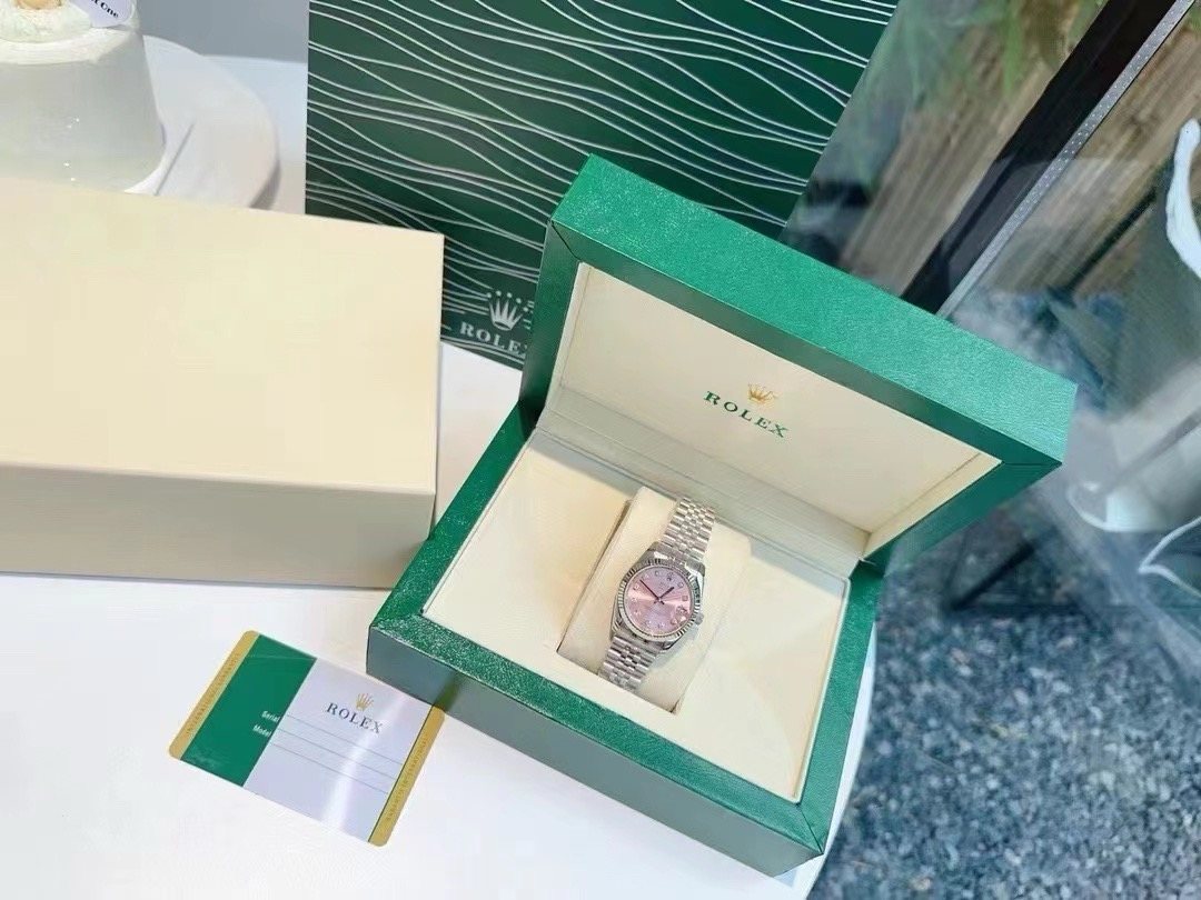 Rolex Pink Dial Silver Bracelet Watch — front