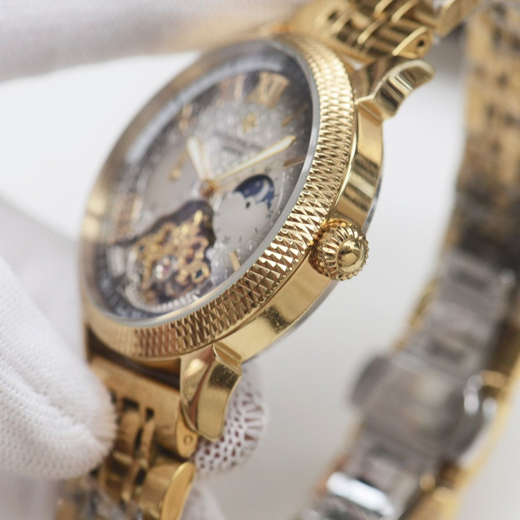 Patek Philippe Gold Silver Dial Bracelet Watch — side