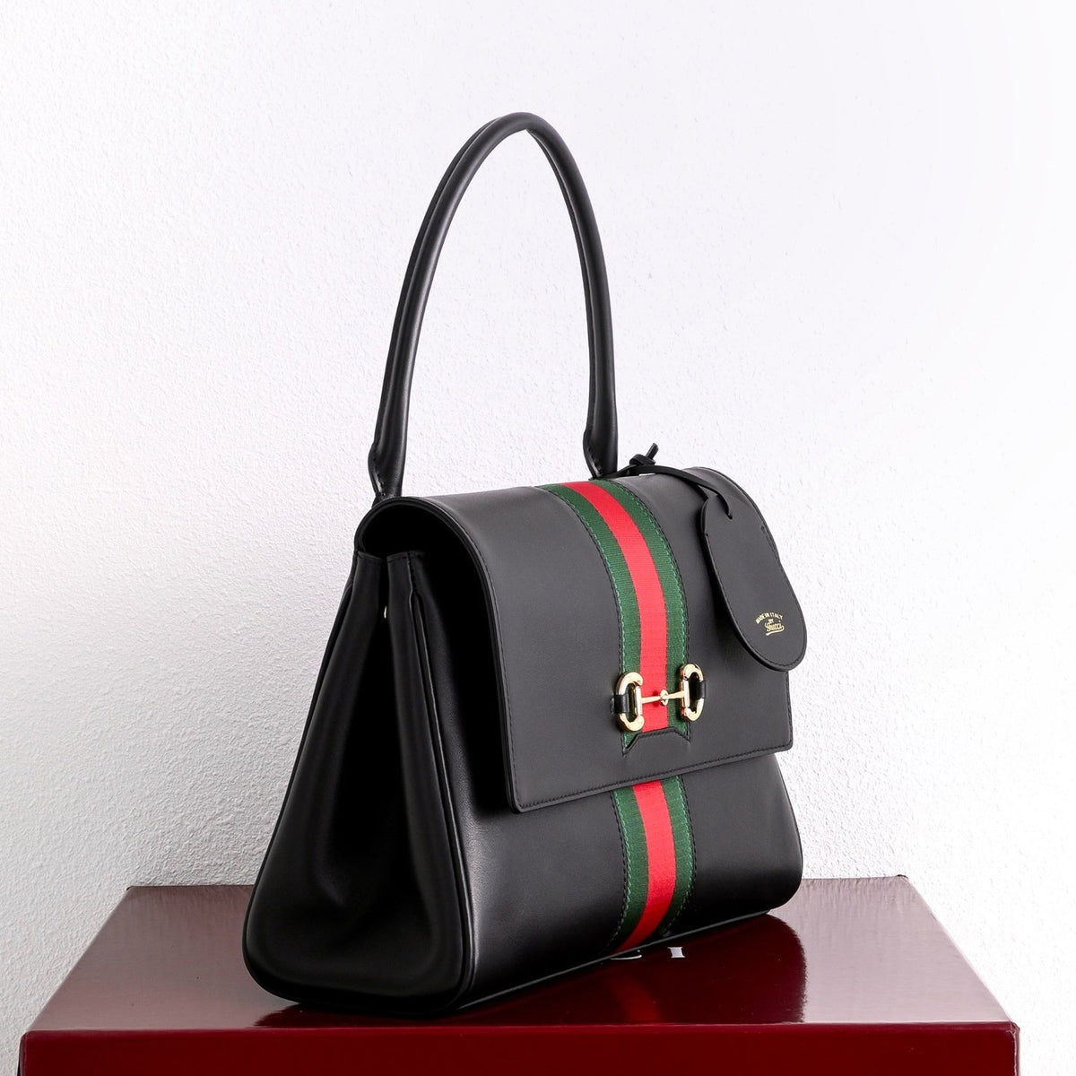 Gucci GG Paparazzo Medium Top Handle Bag